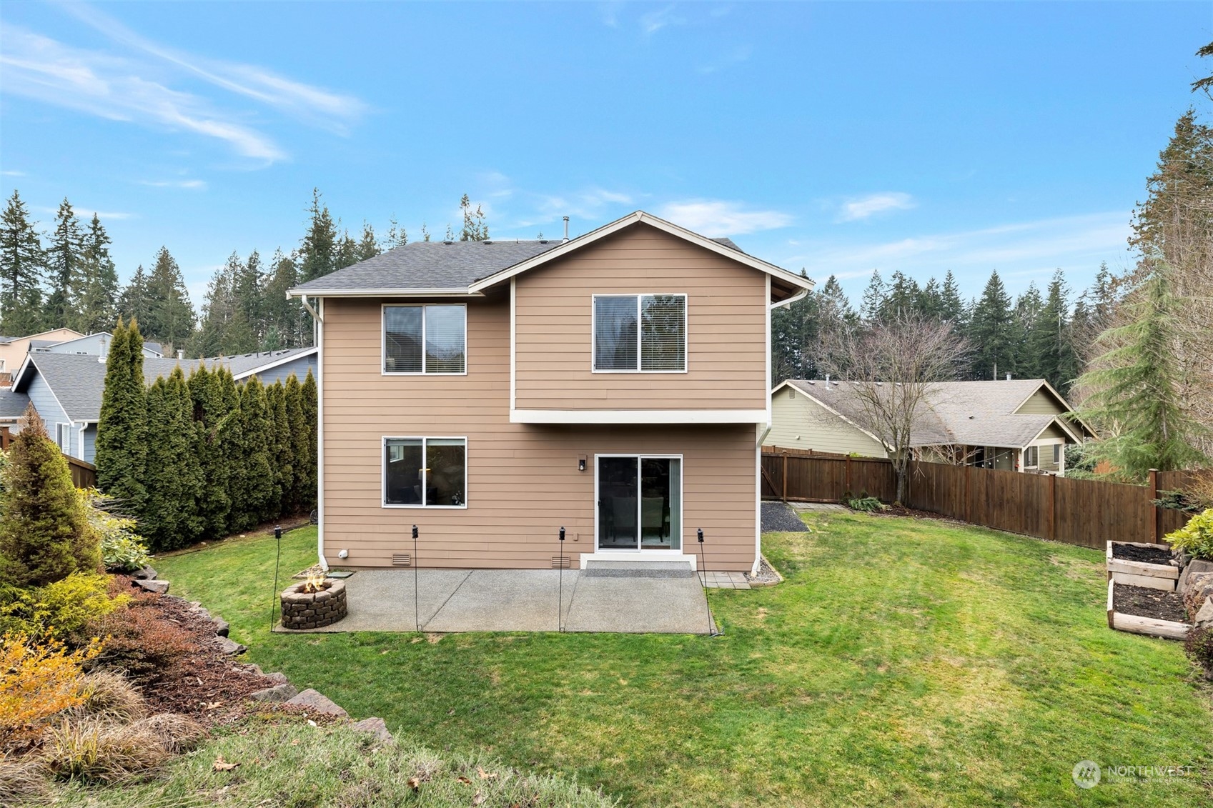 19867 Mountain Ridge Road Southeast Monroe, WA 98272 - Photo 36 of 40 a view of a house with a yard and sitting area