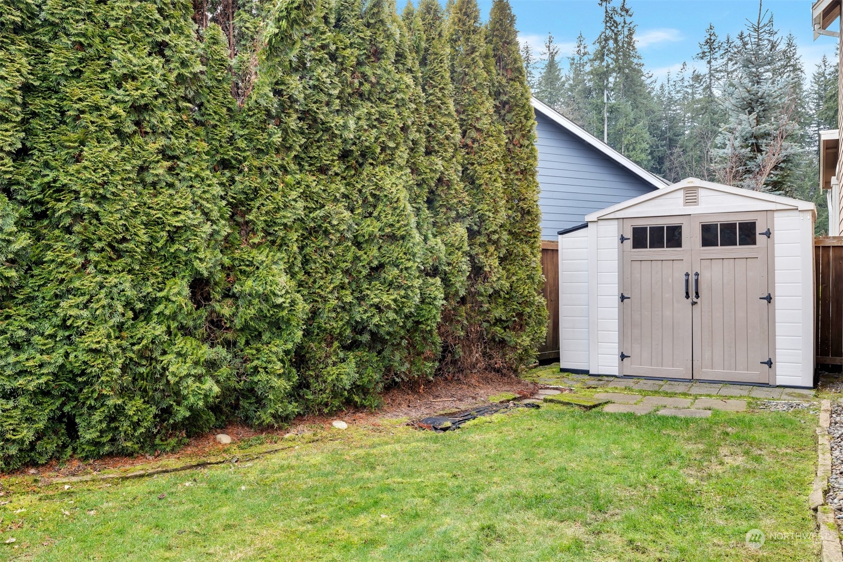 19867 Mountain Ridge Road Southeast Monroe, WA 98272 - Photo 37 of 40 a view of a small space in a yard with wooden fence