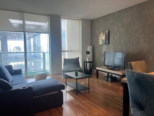 a living room with furniture and a window
