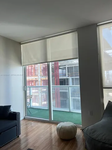 a living room with furniture and a window