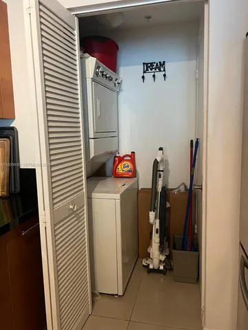 a utility room with closet dryer and washer