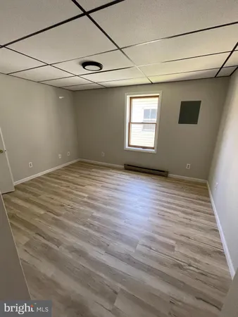 a view of an empty room with a window