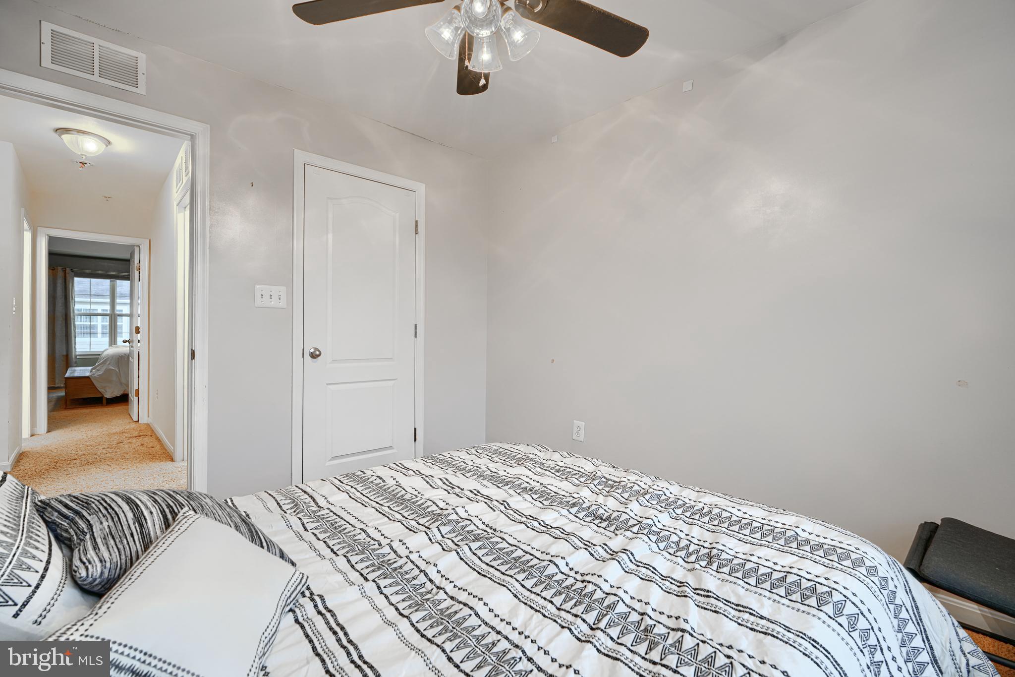 2642 Shade Branch Road Hanover, MD 21076 - Photo 18 of 29 a bedroom with a bed and a chandelier