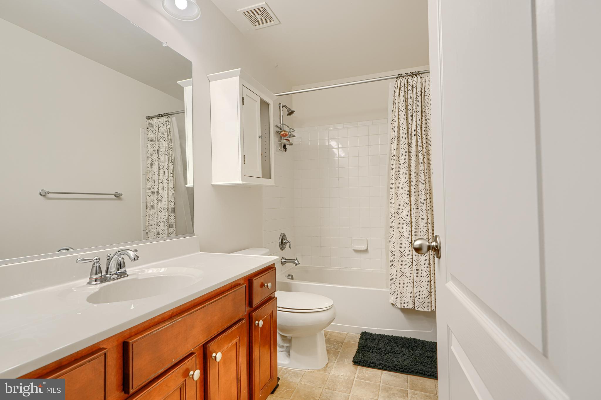 2642 Shade Branch Road Hanover, MD 21076 - Photo 21 of 29 a bathroom with a sink a toilet and shower