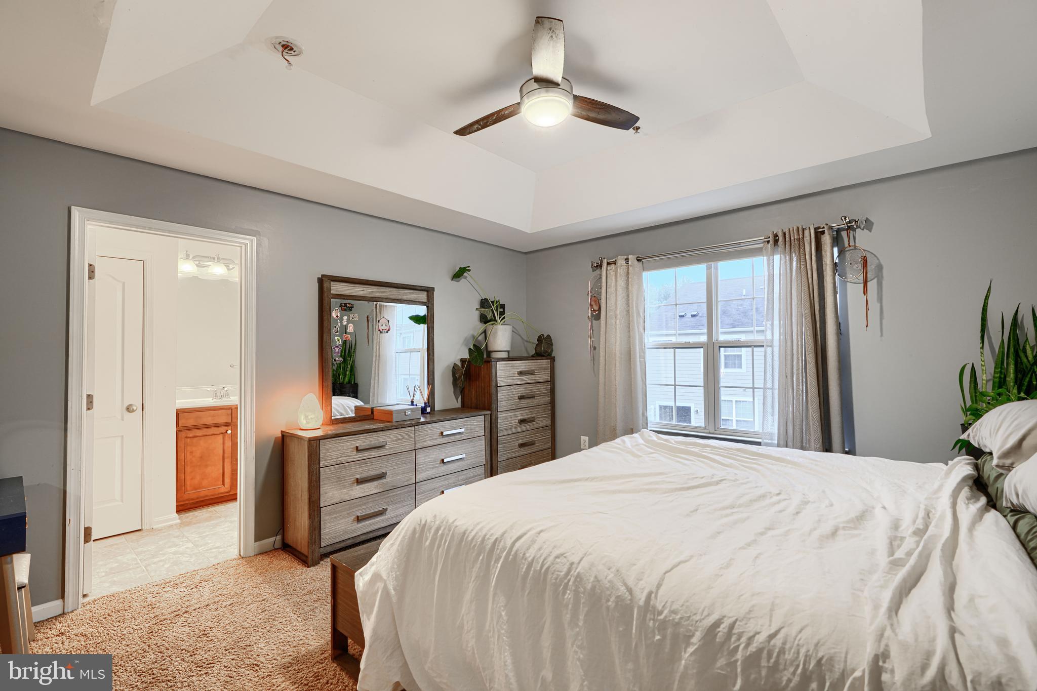 2642 Shade Branch Road Hanover, MD 21076 - Photo 23 of 29 a spacious bedroom with a bed a dresser and a chandelier
