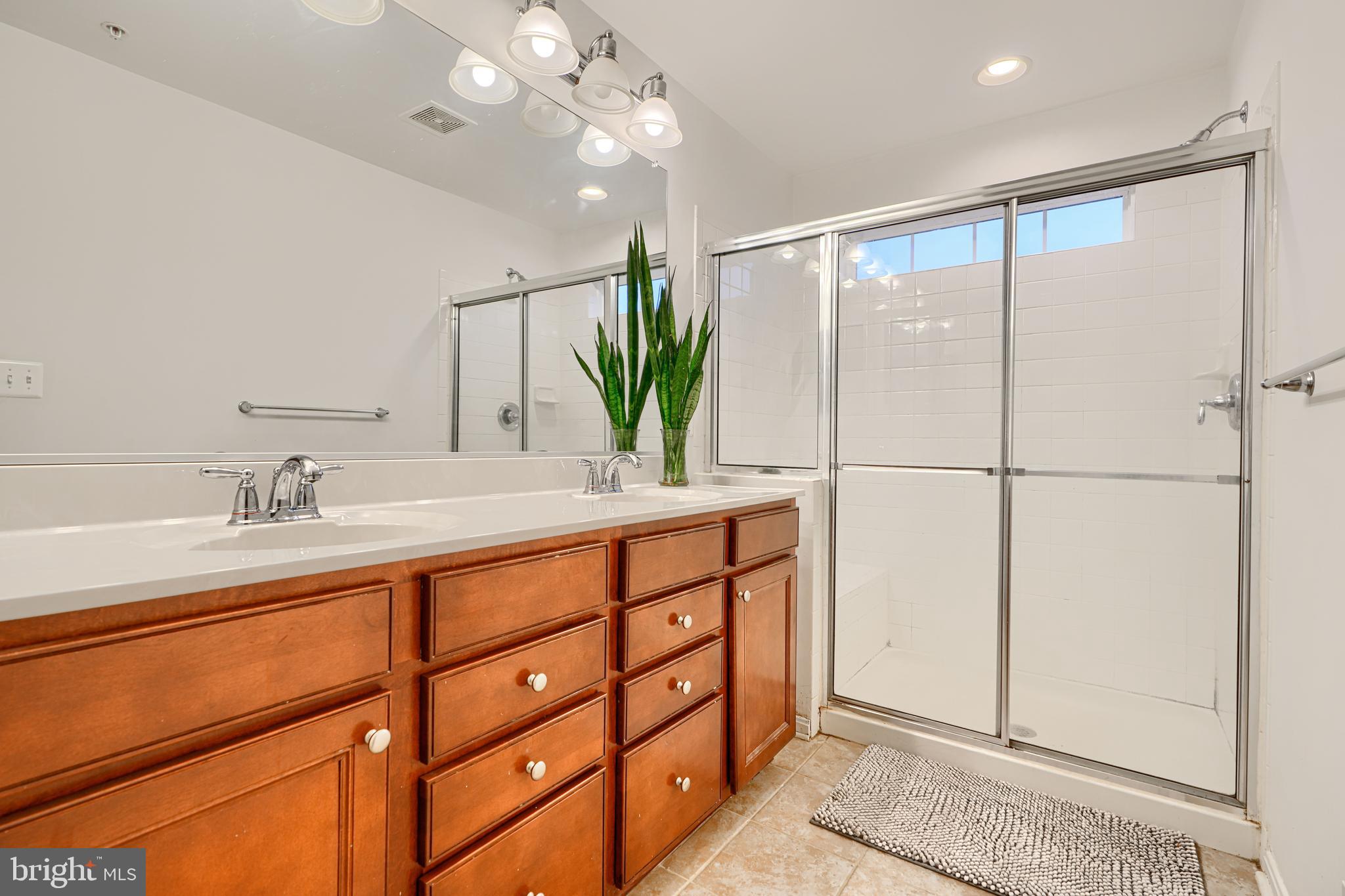 2642 Shade Branch Road Hanover, MD 21076 - Photo 26 of 29 a bathroom with a double vanity sink and a mirror