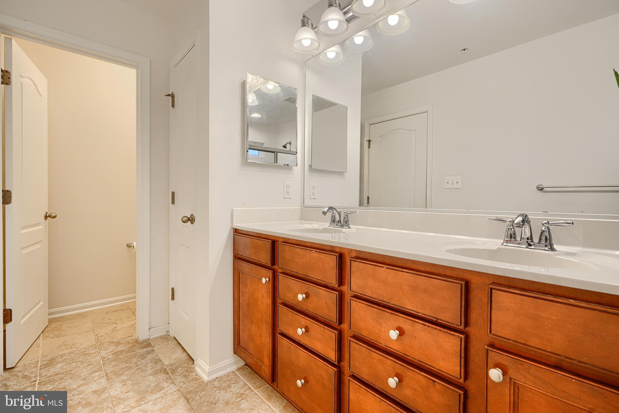 2642 Shade Branch Road Hanover, MD 21076 - Photo 28 of 29 a bathroom with a sink vanity granite shower and a mirror