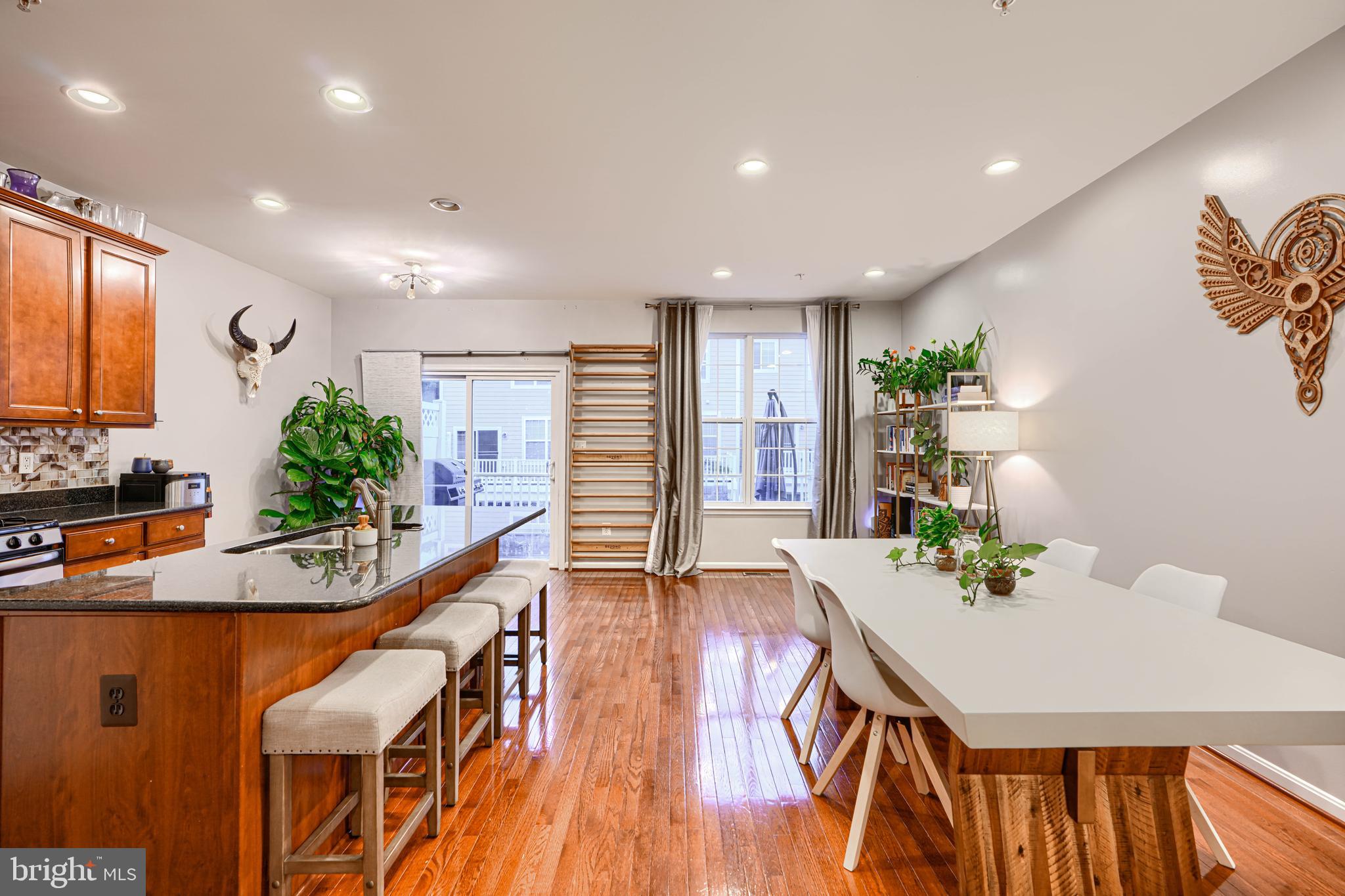 2642 Shade Branch Road Hanover, MD 21076 - Photo 10 of 29 a dining room with furniture and wooden floor