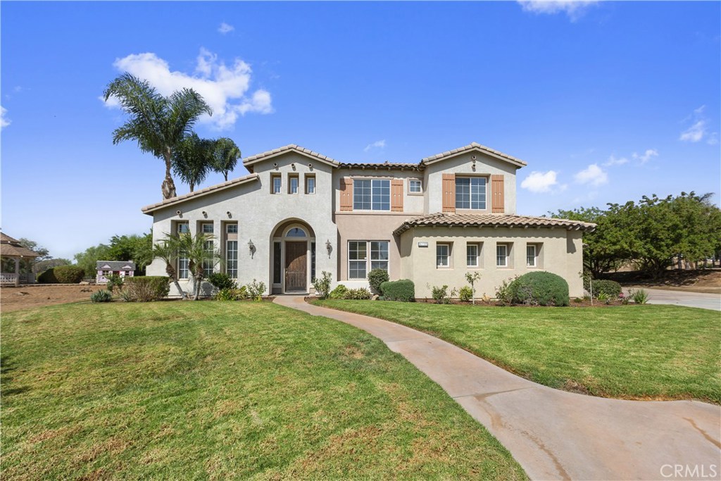 16688 Owl Tree Road Riverside, CA 92504 - Photo 1 of 1 a front view of a house with a garden