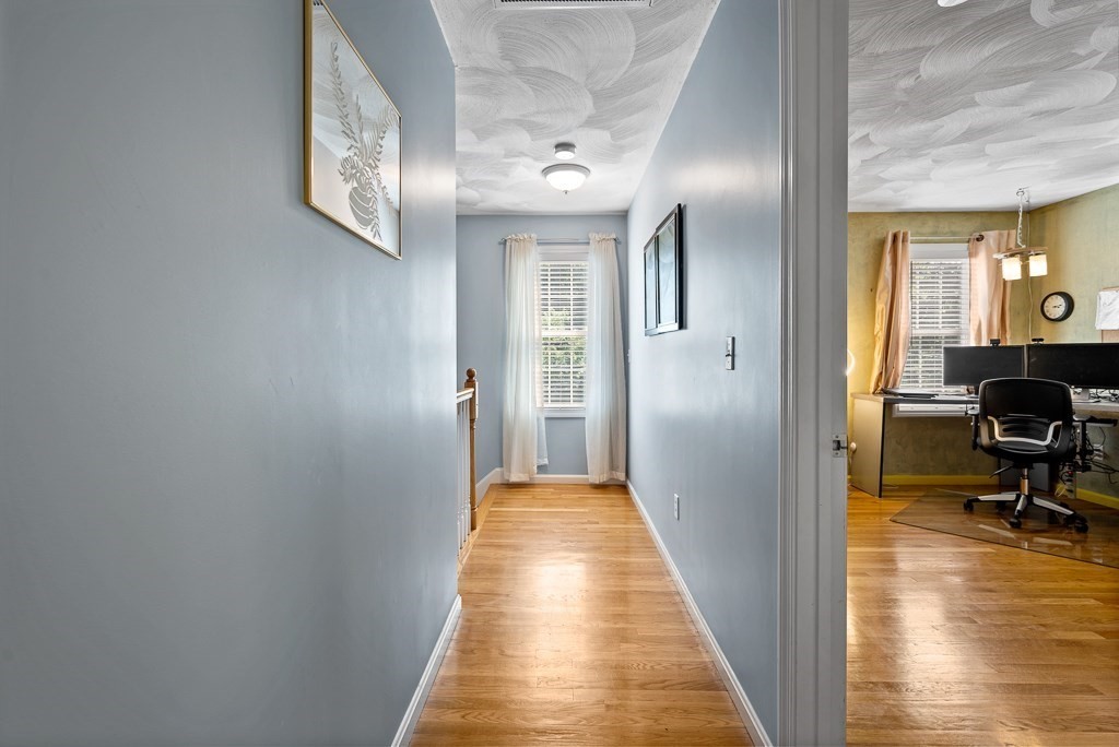 2 Gerry Drive, Unit 2 Hudson, MA 01749 - Photo 13 of 41 a view of a hallway with furniture and a livingroom view
