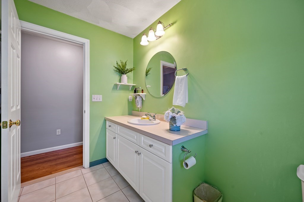 2 Gerry Drive, Unit 2 Hudson, MA 01749 - Photo 15 of 41 a bathroom with a sink and a mirror