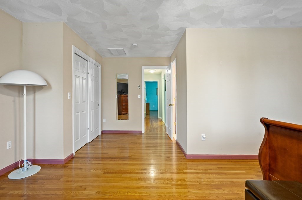 2 Gerry Drive, Unit 2 Hudson, MA 01749 - Photo 20 of 41 a view of a room with wooden floor and couch