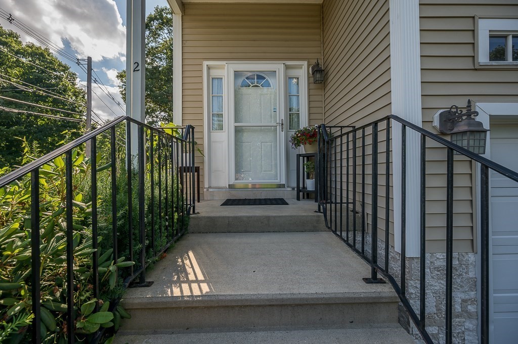 2 Gerry Drive, Unit 2 Hudson, MA 01749 - Photo 2 of 41 a view of a house with a street