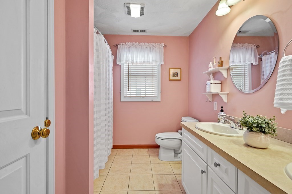 2 Gerry Drive, Unit 2 Hudson, MA 01749 - Photo 22 of 41 a bathroom with a sink a toilet and mirror