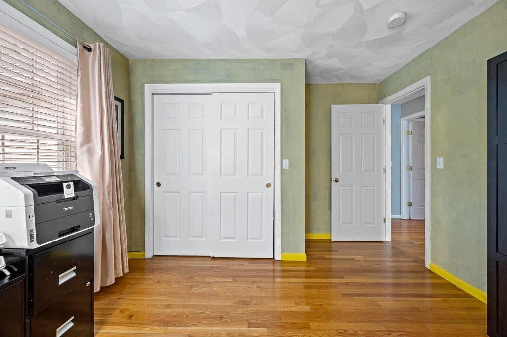 2 Gerry Drive, Unit 2 Hudson, MA 01749 - Photo 24 of 41 a view of empty room with wooden floor