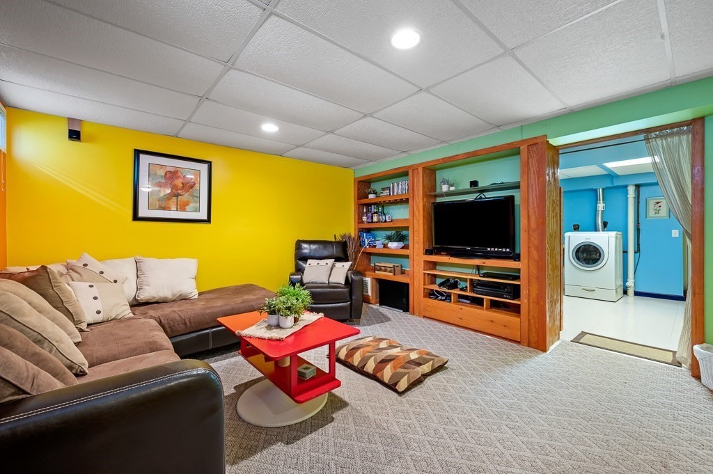 2 Gerry Drive, Unit 2 Hudson, MA 01749 - Photo 27 of 41 a living room with furniture and a flat screen tv