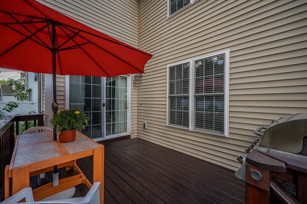 2 Gerry Drive, Unit 2 Hudson, MA 01749 - Photo 29 of 41 a view of a house with a deck