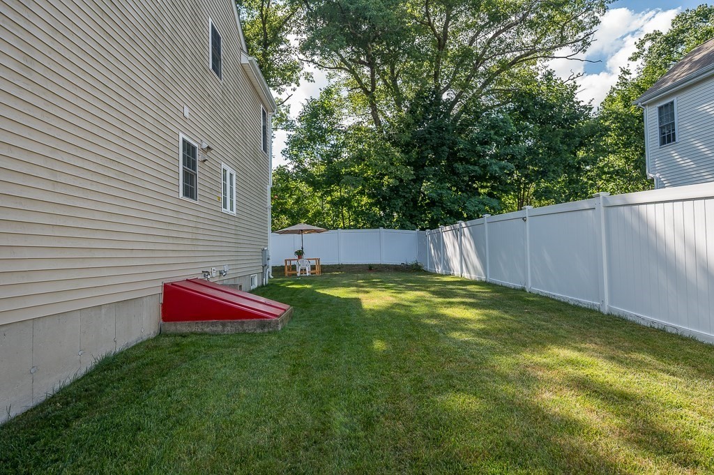 2 Gerry Drive, Unit 2 Hudson, MA 01749 - Photo 35 of 41 a backyard of a house with lots of green space