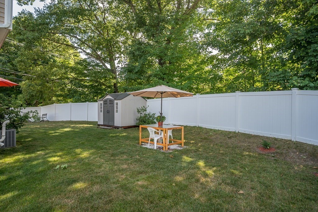2 Gerry Drive, Unit 2 Hudson, MA 01749 - Photo 36 of 41 a backyard of a house with table and chairs