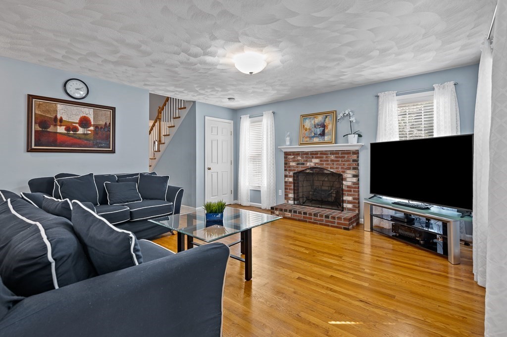 2 Gerry Drive, Unit 2 Hudson, MA 01749 - Photo 4 of 41 a living room with furniture and a flat screen tv