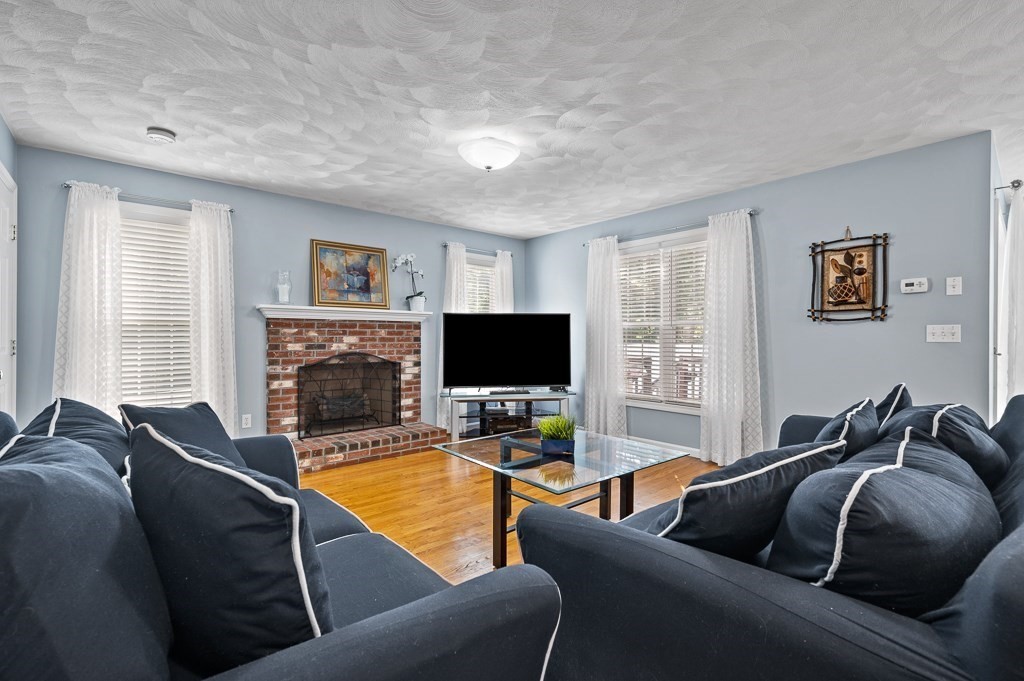 2 Gerry Drive, Unit 2 Hudson, MA 01749 - Photo 5 of 41 a living room with furniture and a flat screen tv