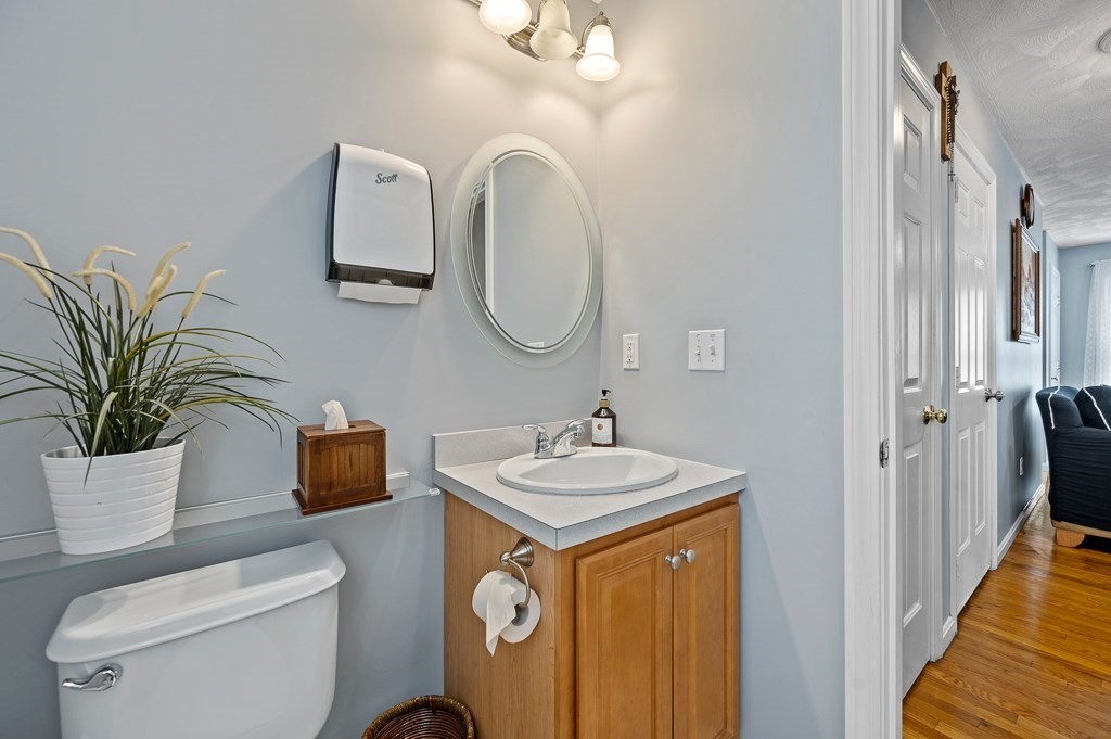 2 Gerry Drive, Unit 2 Hudson, MA 01749 - Photo 7 of 41 a bathroom with a toilet a sink and a mirror
