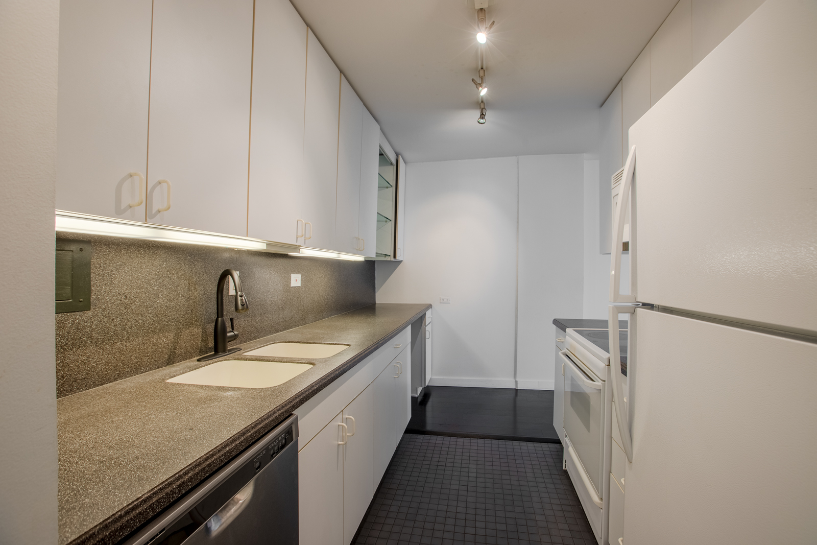 Undisclosed Address Chicago, IL 60611 - Photo 3 of 9 a bathroom with a double vanity sink and mirror