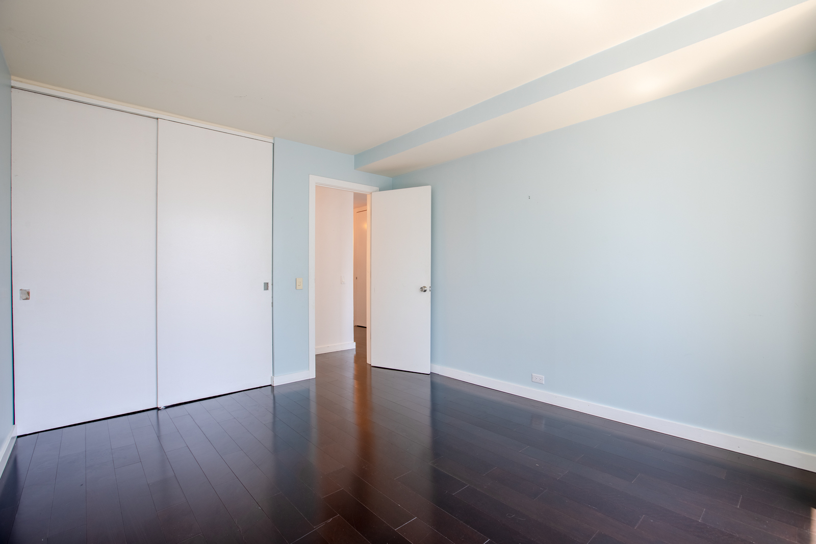 Undisclosed Address Chicago, IL 60611 - Photo 8 of 9 a view of an empty room with wooden floor