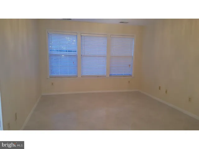 a open hall with a painting on the wall