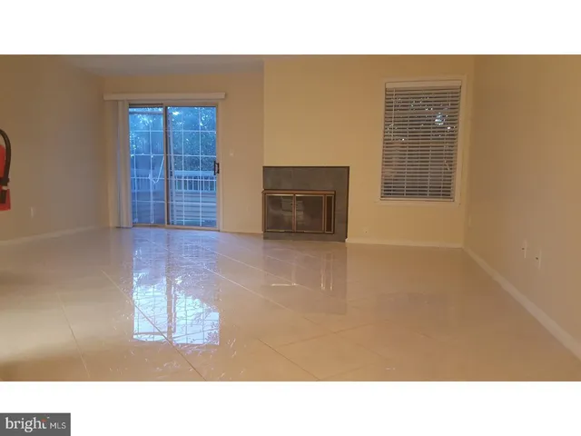 a black and white photo of a living room