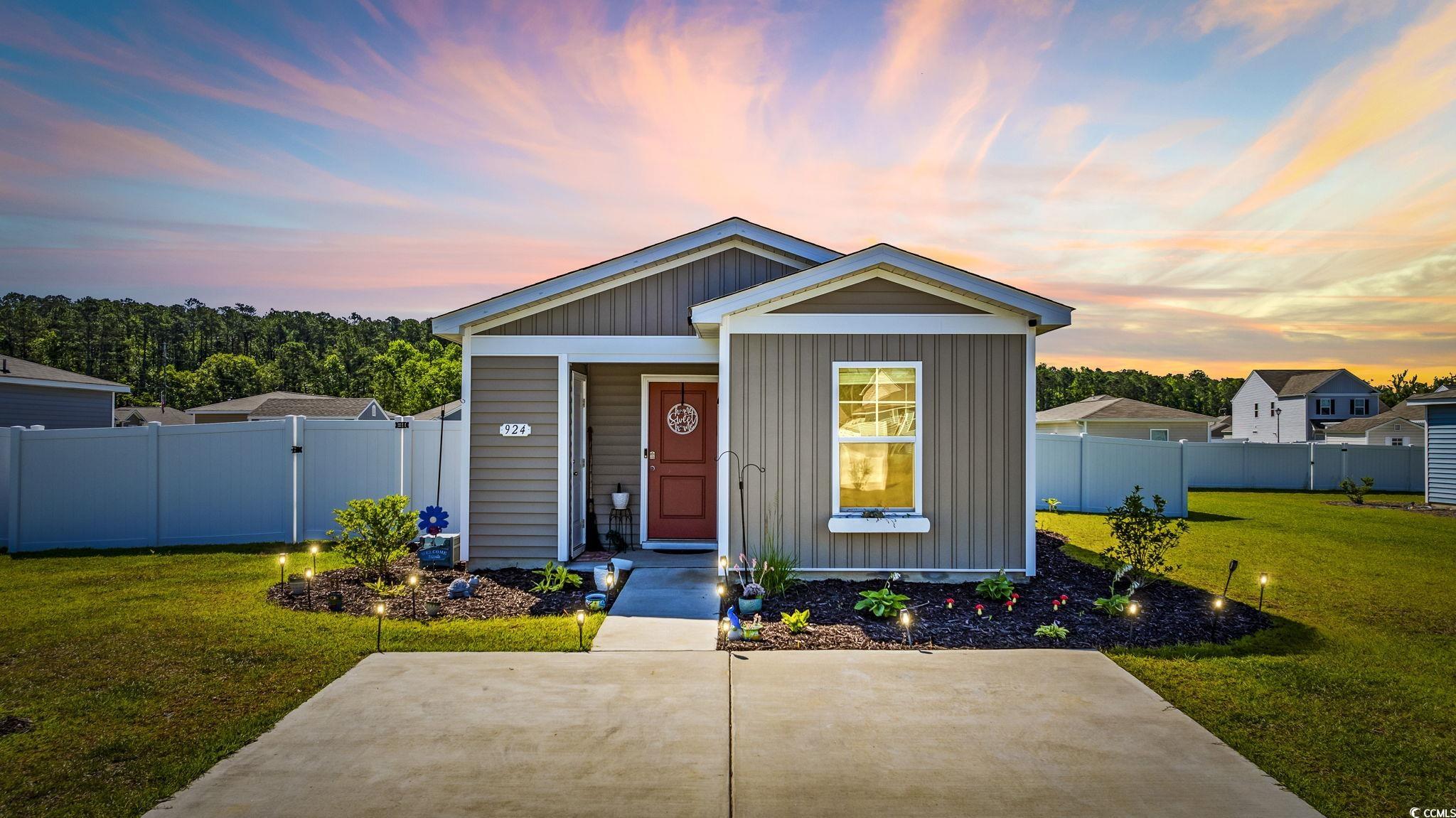 Bungalow with board and batten siding and covered porch
