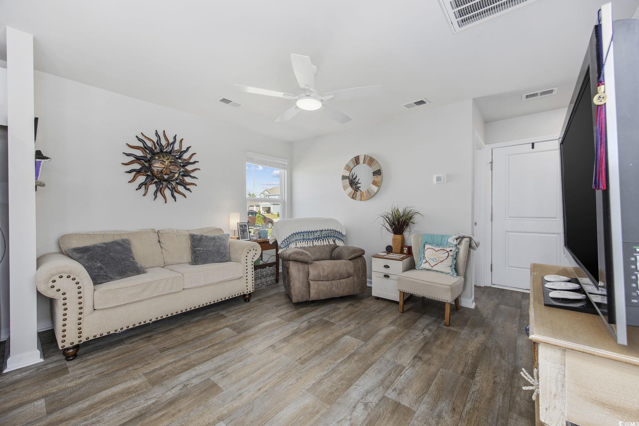 924 Akron Street Conway, SC 29526 - Photo 11 of 37 Living area with wood finished floors and ceiling fan