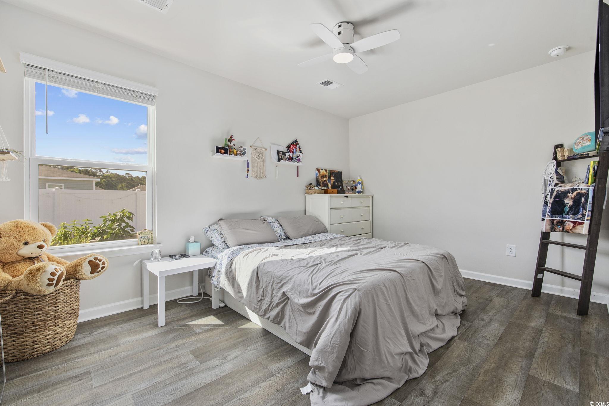 924 Akron Street Conway, SC 29526 - Photo 18 of 37 Bedroom with wood finished floors, ceiling fan, and baseboards