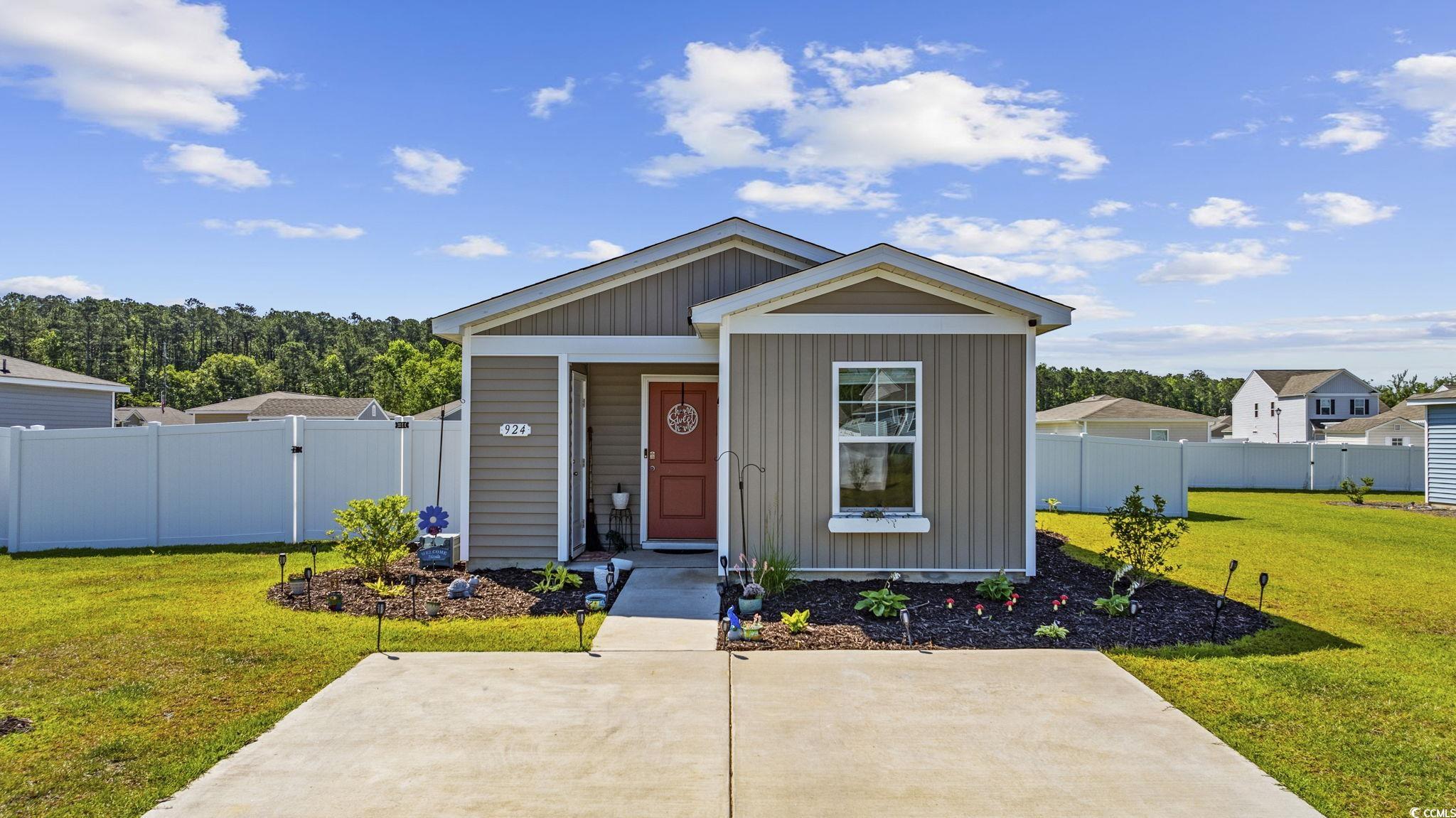924 Akron Street Conway, SC 29526 - Photo 2 of 37 View of front of home with board and batten siding