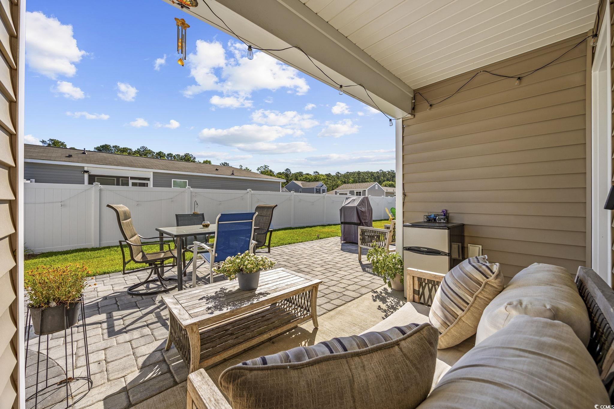 924 Akron Street Conway, SC 29526 - Photo 22 of 37 Fenced backyard featuring a patio area, outdoor lounge area, and outdoor dining area