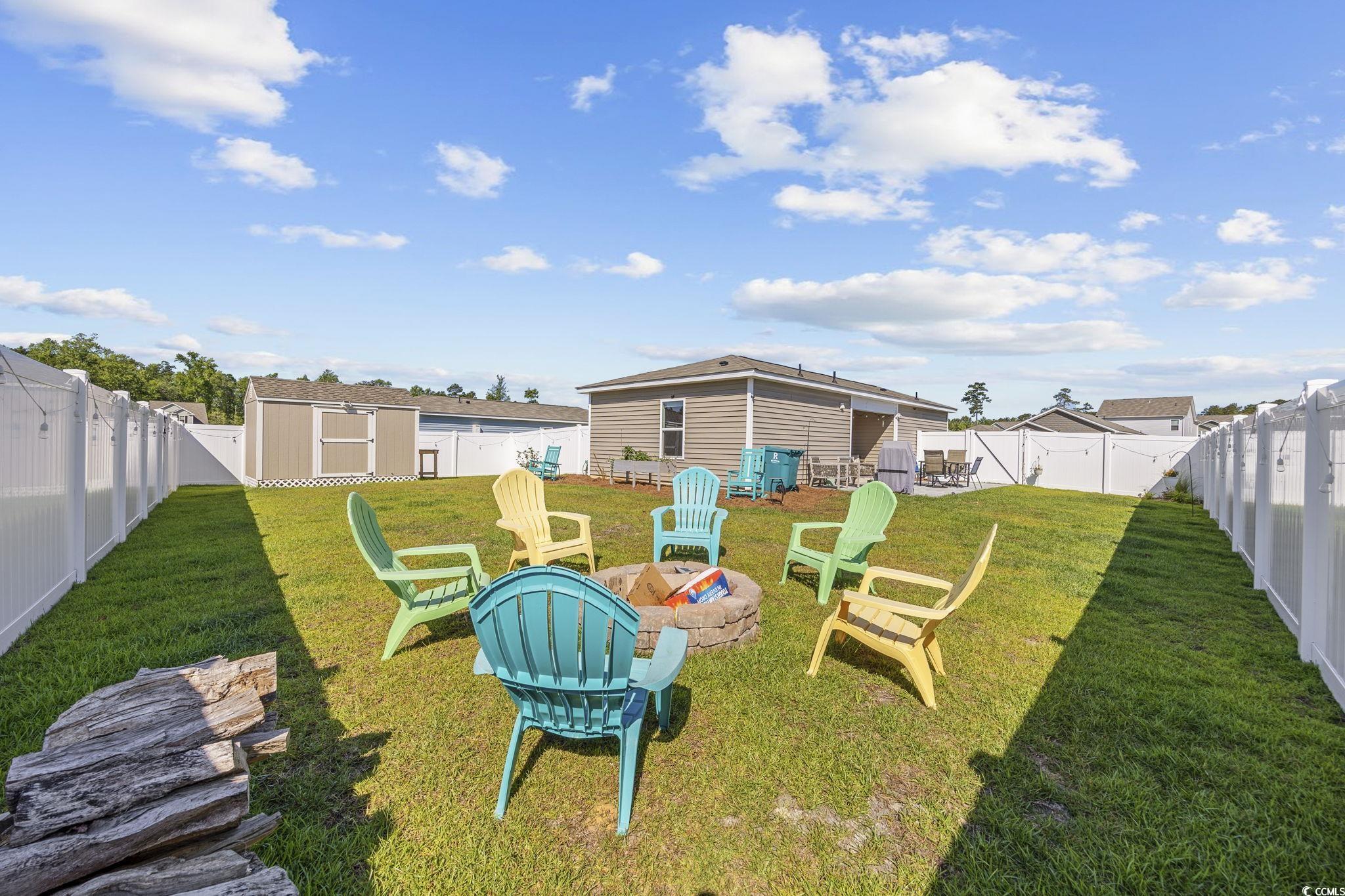 924 Akron Street Conway, SC 29526 - Photo 25 of 37 View of yard with a fire pit