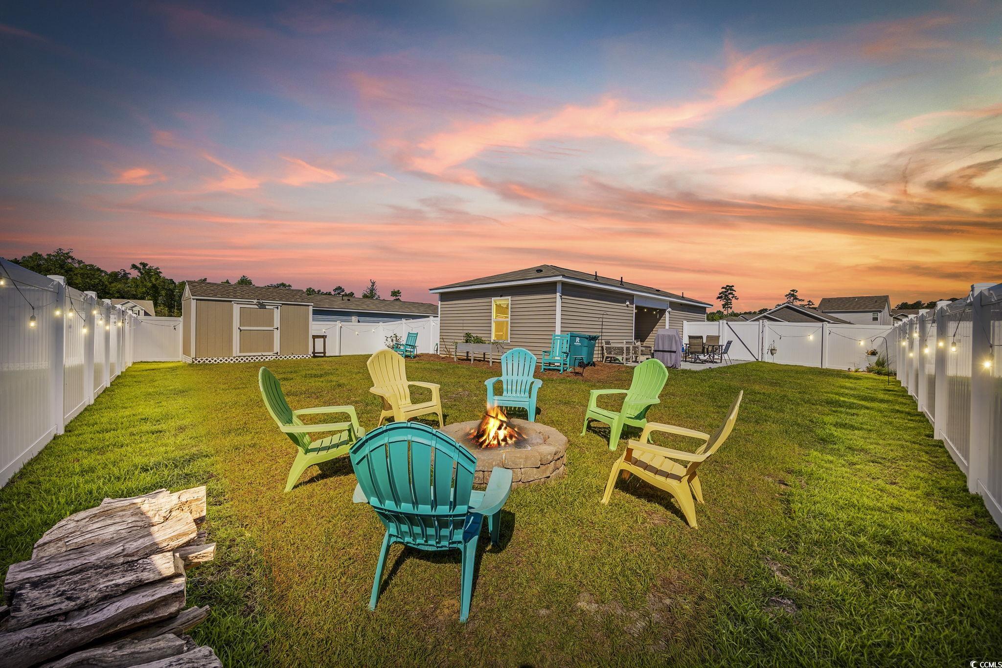 924 Akron Street Conway, SC 29526 - Photo 26 of 37 View of yard with an outdoor fire pit
