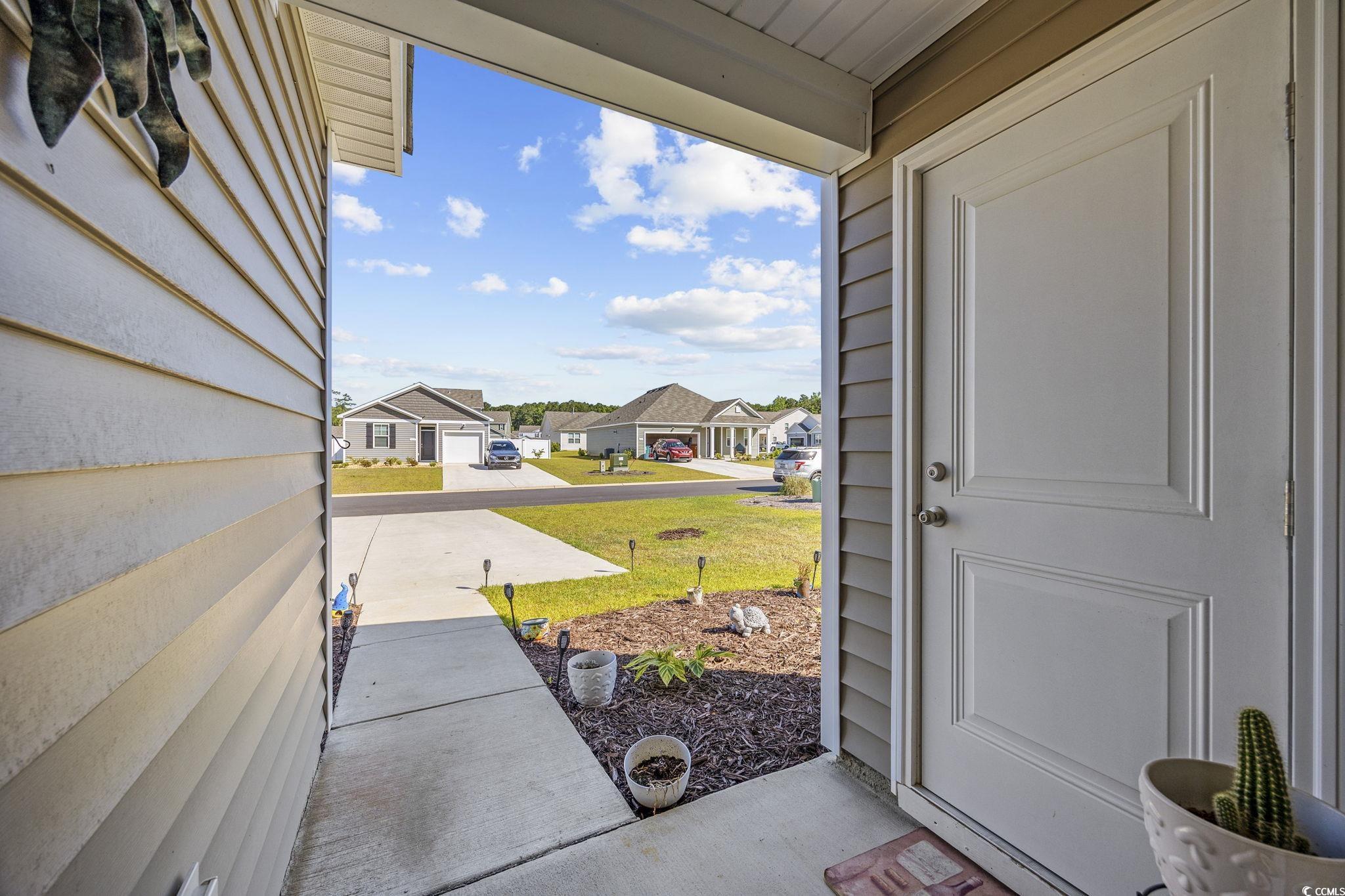 924 Akron Street Conway, SC 29526 - Photo 5 of 37 Property entrance featuring a residential view and a lawn