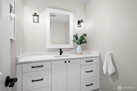 a bathroom with a sink and a mirror