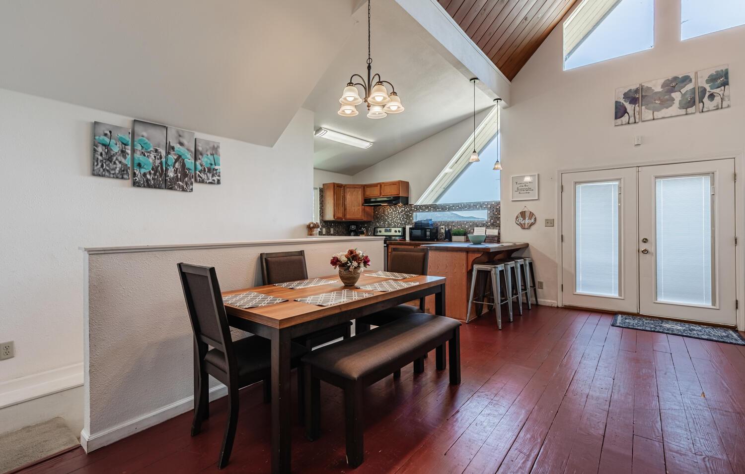 42492 Buckeye Road Oakhurst, CA 93644 - Photo 15 of 38 a view of a dining room with furniture and wooden floor