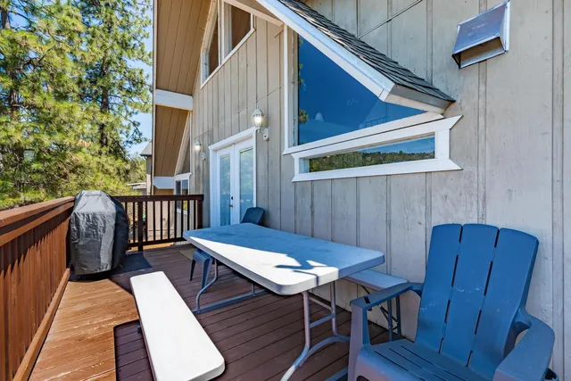a view of balcony with wooden floor and outdoor seating