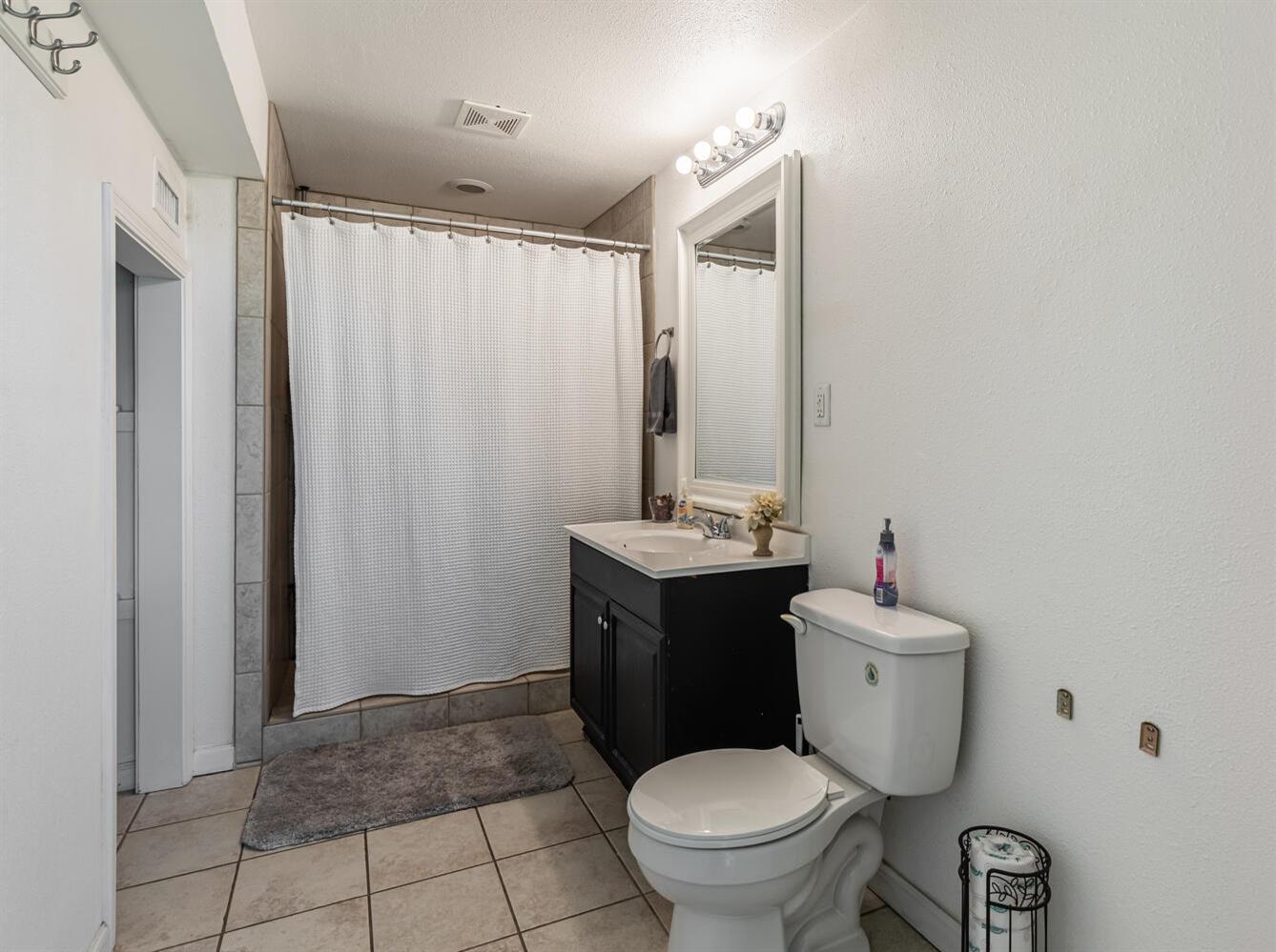 42492 Buckeye Road Oakhurst, CA 93644 - Photo 24 of 38 a bathroom with a toilet sink and mirror