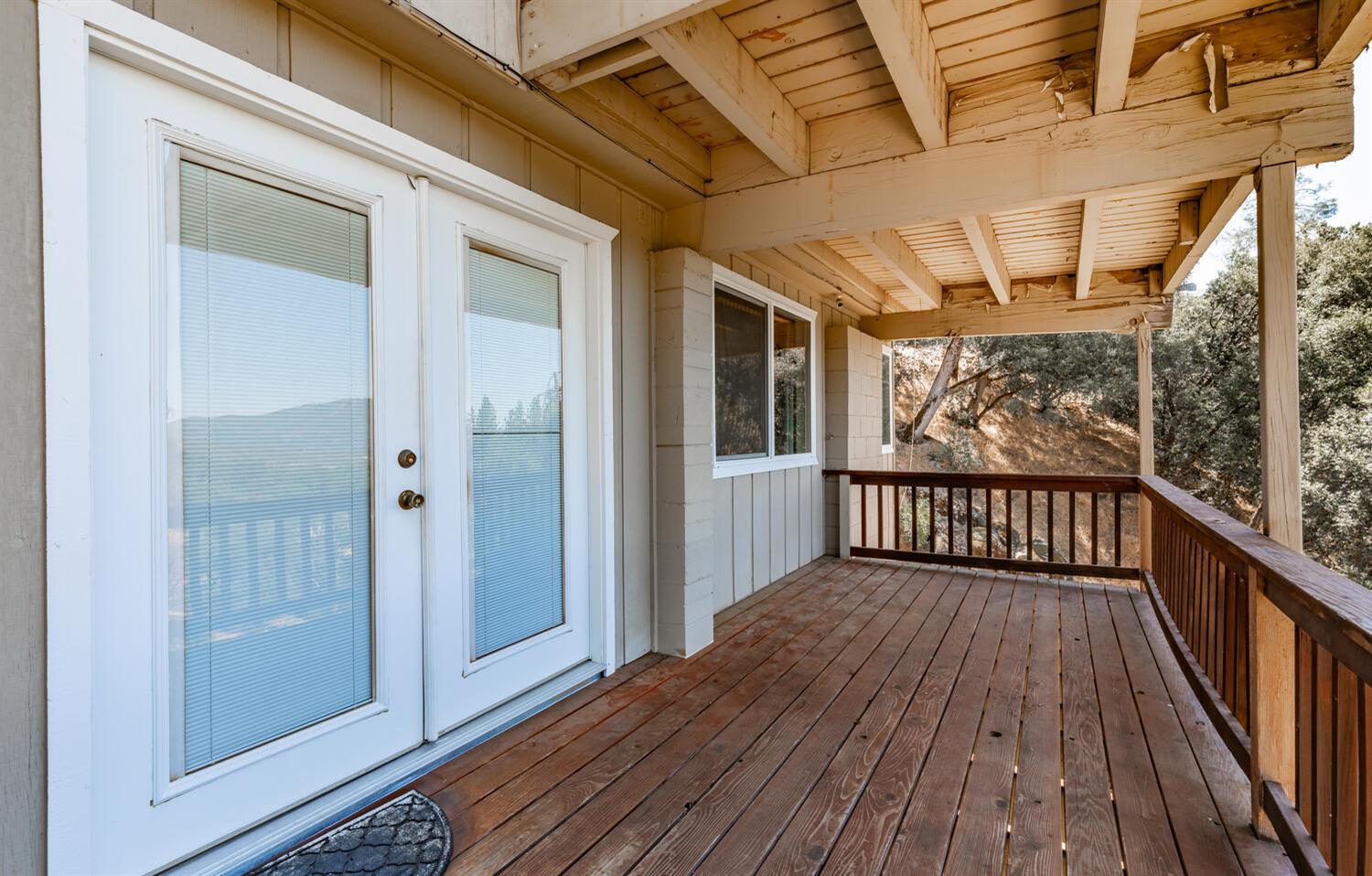 42492 Buckeye Road Oakhurst, CA 93644 - Photo 33 of 38 a view of a balcony with wooden floor