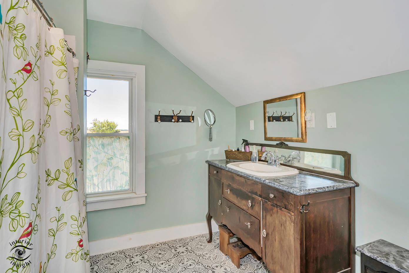 1258 East 2900 North Road Clifton, IL 60927 - Photo 11 of 38 a bathroom with a granite countertop sink and a mirror