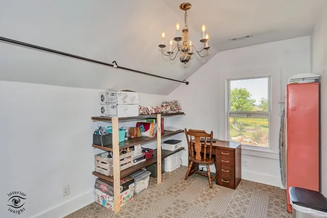 a living room with furniture a large window with outer view