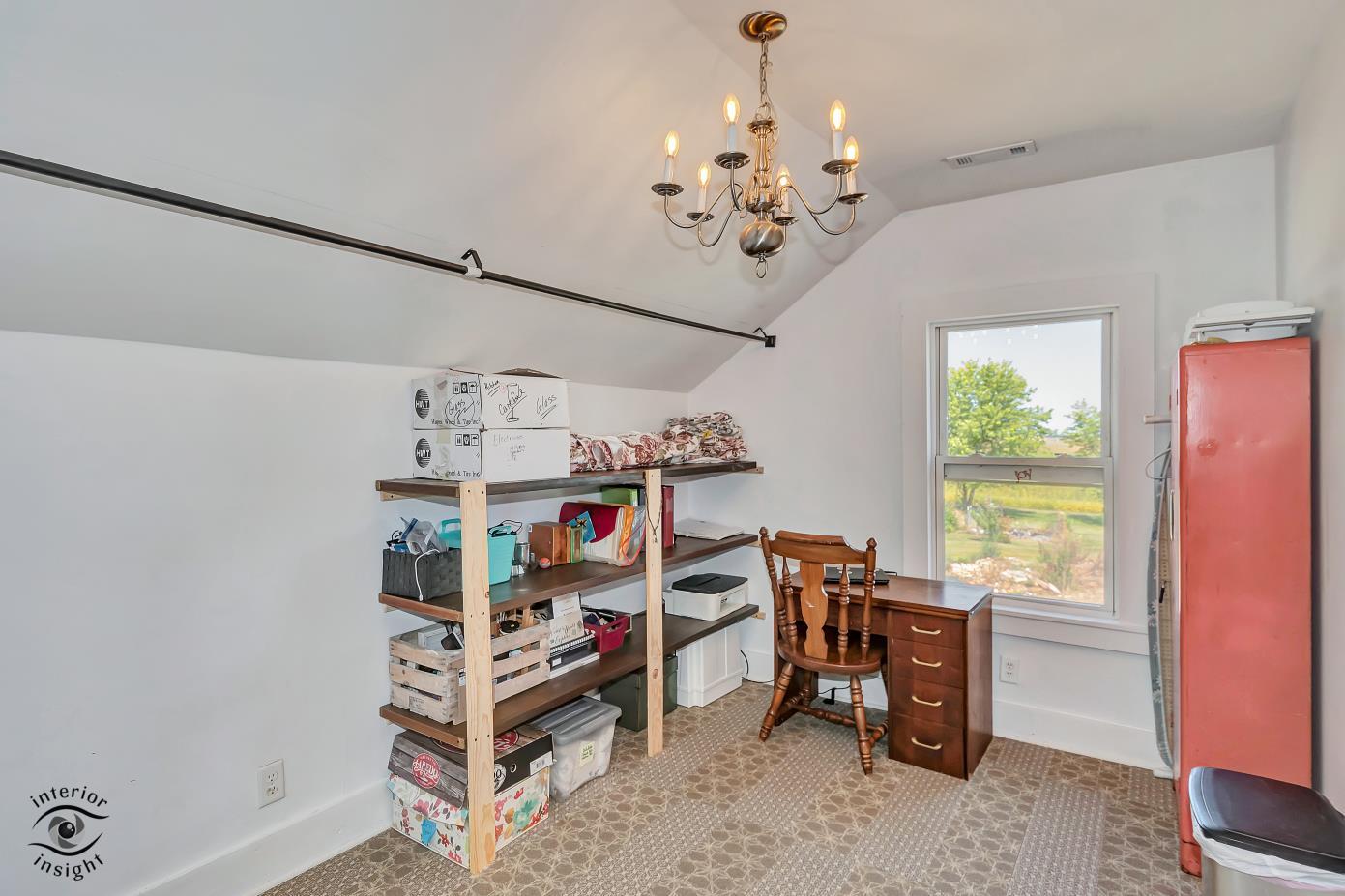 1258 East 2900 North Road Clifton, IL 60927 - Photo 14 of 38 a room with furniture and a chandelier