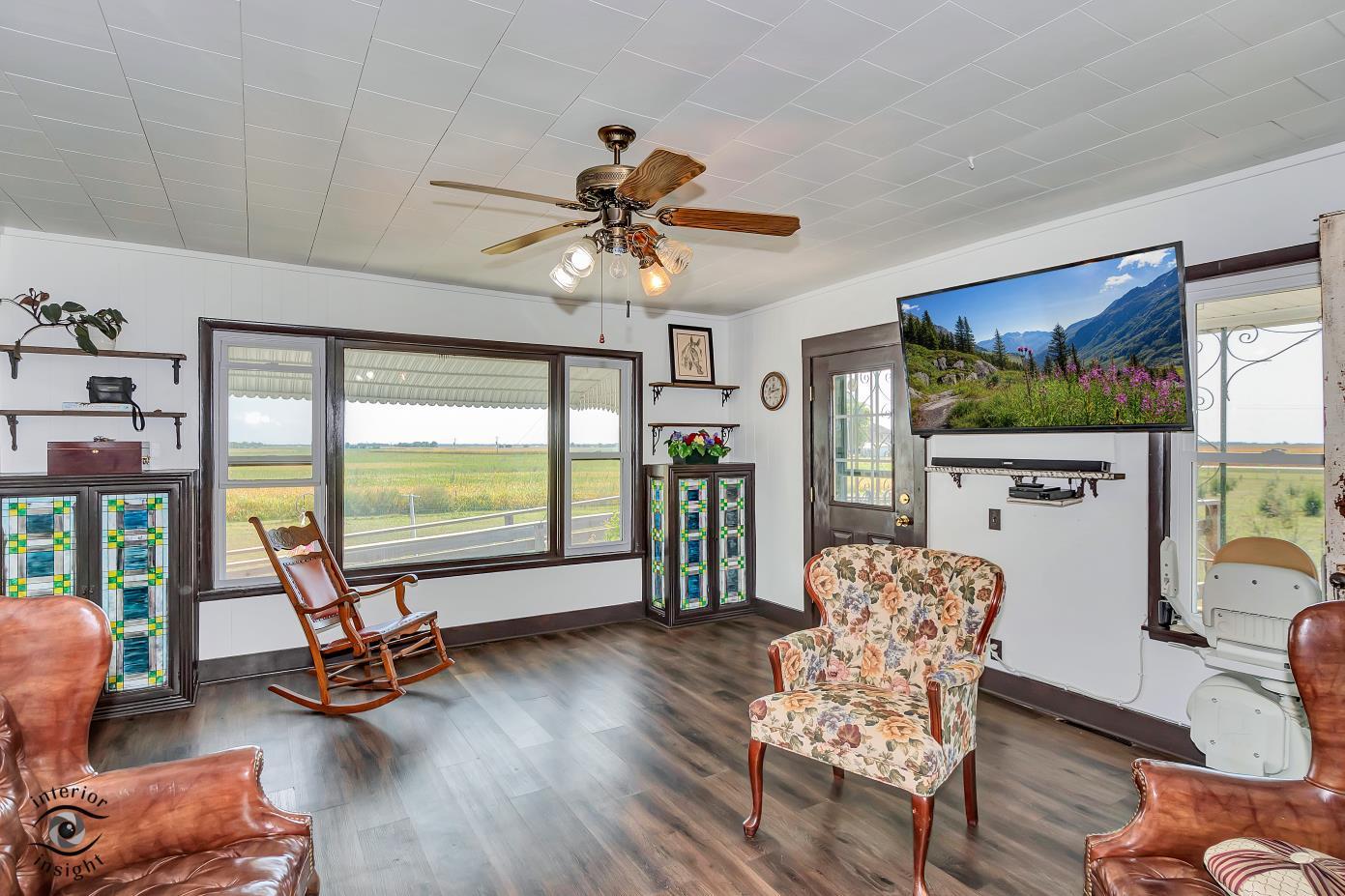 1258 East 2900 North Road Clifton, IL 60927 - Photo 15 of 38 a living room with furniture a large window with outer view