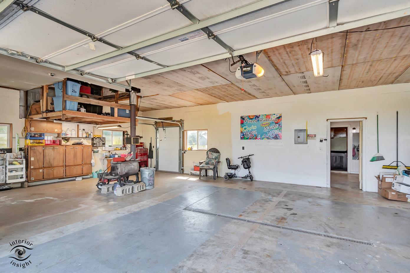 1258 East 2900 North Road Clifton, IL 60927 - Photo 19 of 38 a view of a garage with chairs