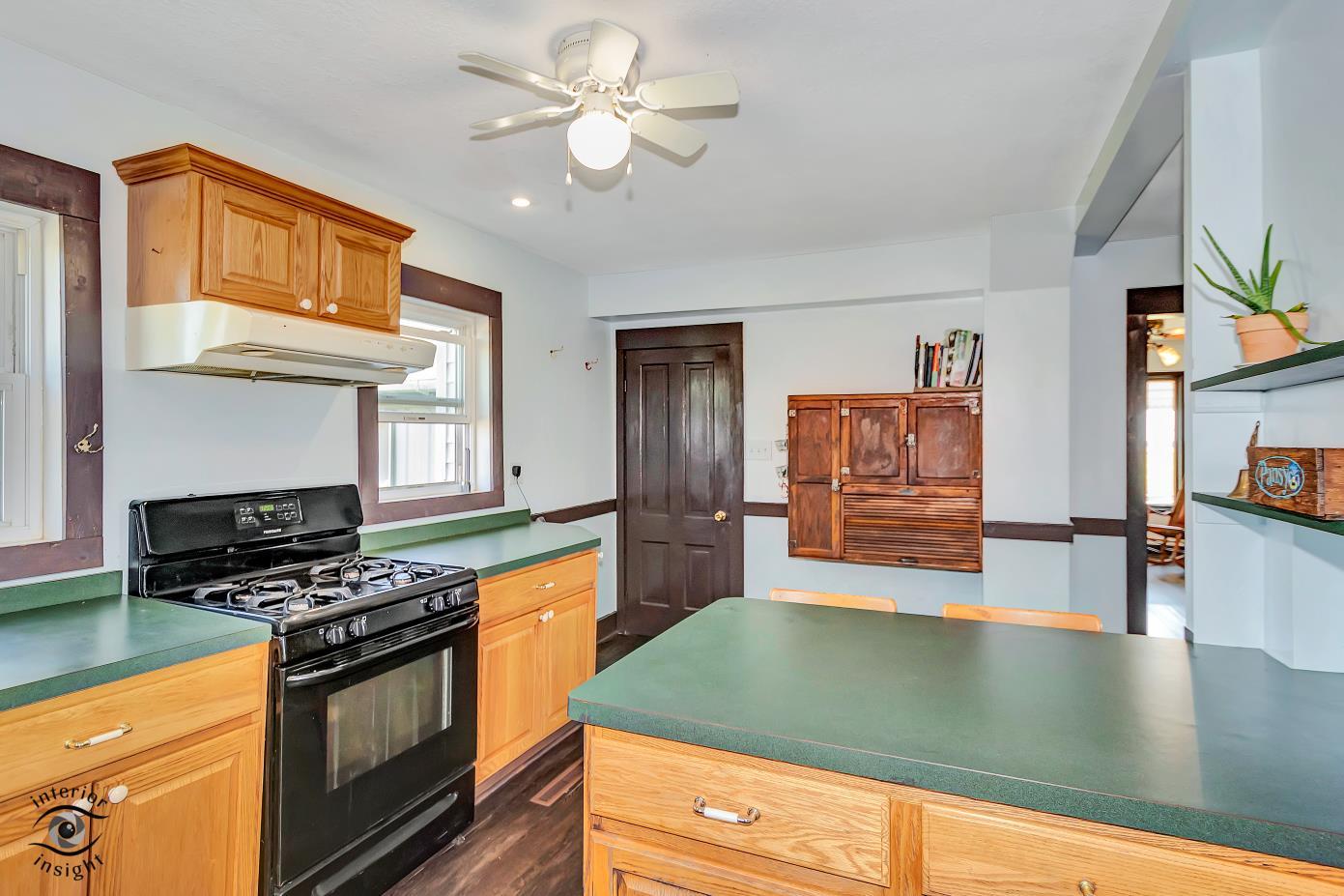 1258 East 2900 North Road Clifton, IL 60927 - Photo 7 of 38 a kitchen with stainless steel appliances granite countertop a stove a sink and a refrigerator