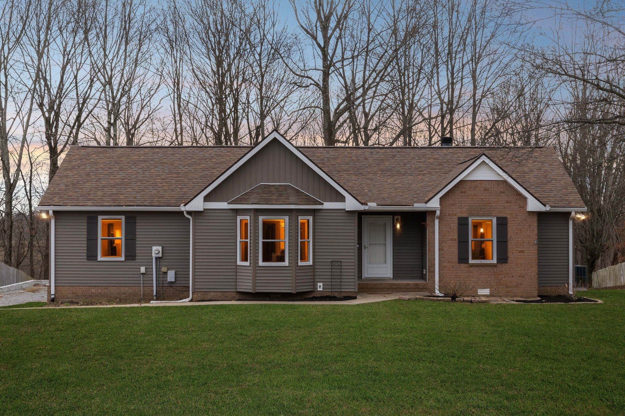 front view of a house with a yard
